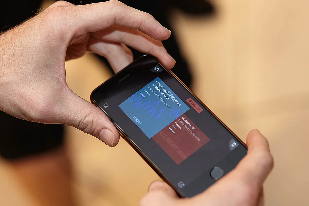Crossfader music mixing app interface on smartphone